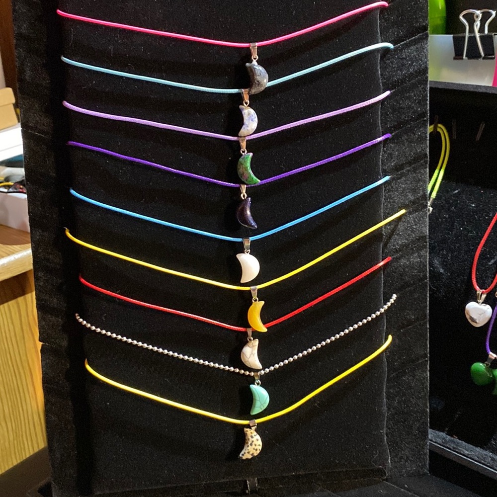Small moon pendants on rope chains